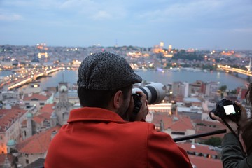 Photographer taking photos of Golden Horn at Galata Tower