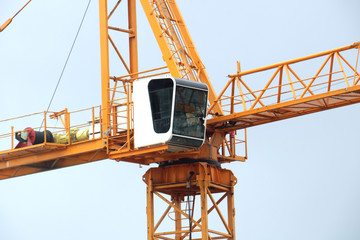 Glass cabin of a tower crane close-up
