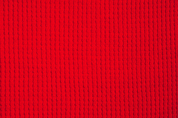 Textured fabric of red color shot close-up