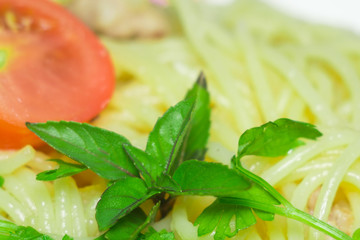 Basil and spaghetti with tomatoes