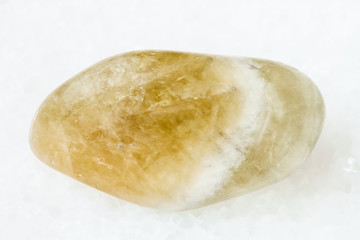 tumbled Prasiolite gemstone on white