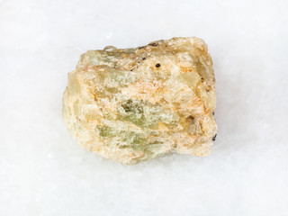 raw chrysoberyl (green beryl) crystal on white