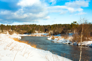 Beautiful Scenic Landscape View In Russia Of River Under Dramatic Sky With Clouds In Sunny Day In Winter. Woods Forest On Riverside.