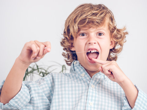 Little boy pulling tooth out