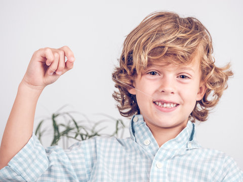Little boy pulling tooth out