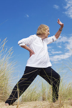 An Old Woman Practicing Tai Chi