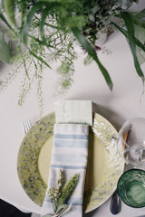 festive porcelain plate on a table with wildflowers