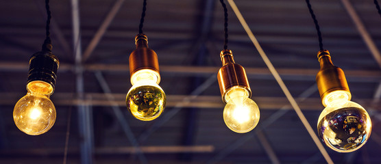 Abstract warm lights hanging from ceiling in local restaurant