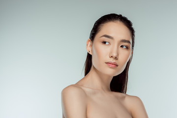 beautiful asian young woman, isolated on grey