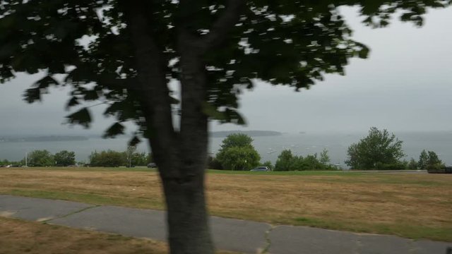 A moving view of Eastern Promenade Park in Portland, Maine on a foggy summer day.  	