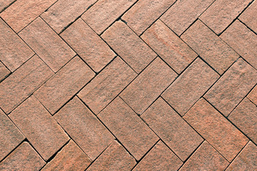 Paving stone in pink granite, cobbles.