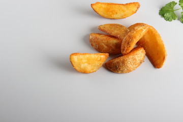 country slices potatoes on white background