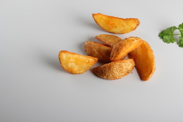 country slices potatoes on white background
