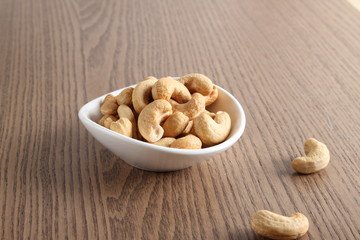 cashew nuts on wooden background