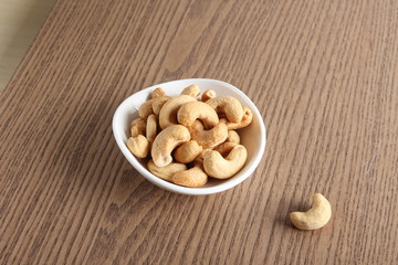 cashew nuts on wooden background