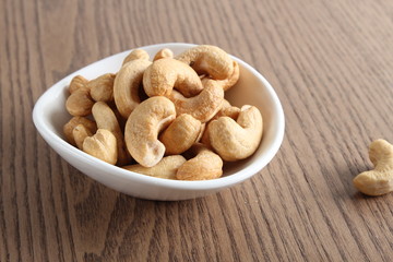 cashew nuts on wooden background