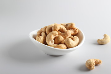 Fototapeta na wymiar cashew nuts on gray background