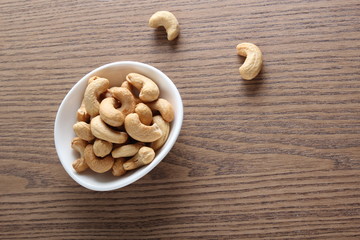 cashew nuts on wooden background