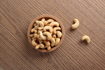 cashew nuts on wooden background