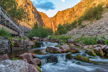 sunrise over stream and waterfall Njupeskar in Fulufjallet natur