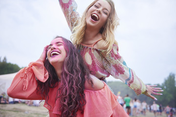 Playful friends having fun at the music festival