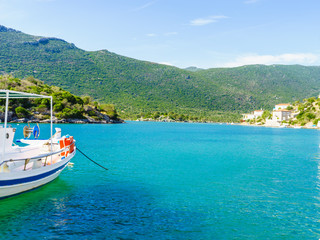Jetty pier on coastline with boat yacht.