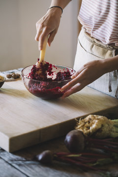 Preparation of beetroot ravioli with sage and butter, pounding the filling