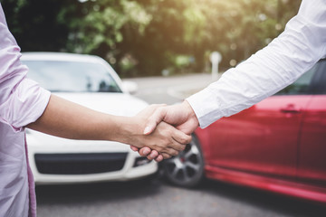 Insurance Agent and customer shaking hands after claim contact, Traffic Accident and insurance...