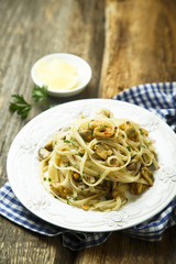 Homemade seafood pasta with white wine and lemon
