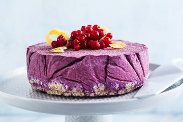 raw vegan cake from cashew nuts and blueberries. healthy sweets. milk , flour and  gluten free. on a marble table