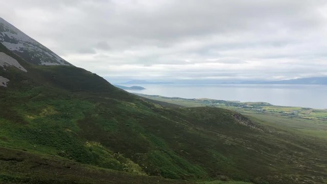 View from Croagh Patrick mountain in Co. Mayo, Westport, West coast of Ireland, Atlantic ocean. Amazing scenic sea and mountain landscape with islands in cloudy day.