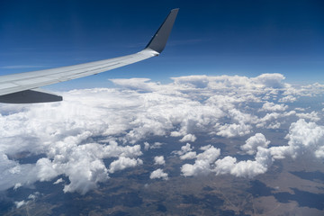 Naklejka na ściany i meble Airplane, plane, airplane window, window seat, flight, clouds