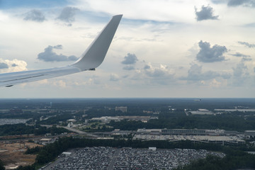 Fototapeta na wymiar Airplane, plane, airplane window, window seat, flight, clouds