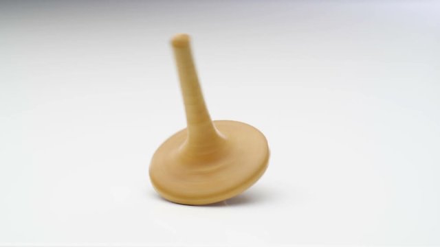 Spinning wooden top. Close up.
