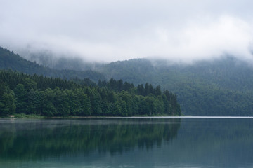 Beautiful mountain lake Alpsee - Hohenschwangau on a cloudy day, Germany