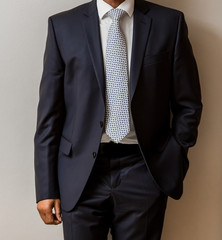 African Black hands and arms of businessman in a suit