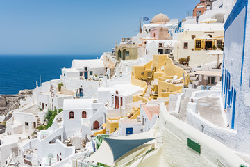 Tiny little white houses, hotels and small churches in the Oia village at Santorini, Greece.