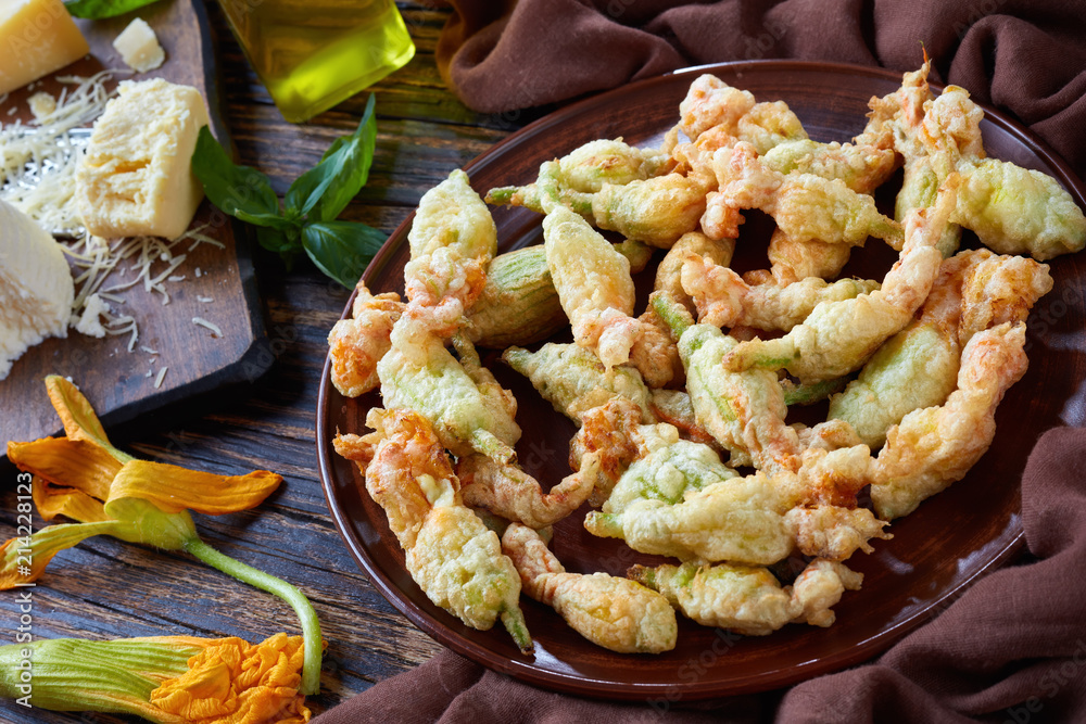 Wall mural deep fried zucchini flowers on a plate