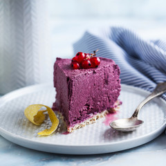 raw vegan cake from cashew nuts and blueberries. healthy sweets. milk , flour and  gluten free. on a marble table