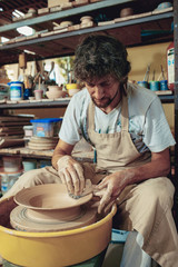 Creating a jar or vase of white clay close-up. Master crock.