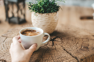 aromatic black coffee on a wooden table, coffee for breakfast in a white cup