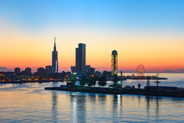 Cityscape of Batumi, Georgia, Black Sea resort city in red summer sunset light