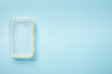 top view of empty food lunch box isolated on blue