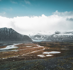 Vatnajokull glacier aerial drone image with clouds and blue sky. Dramatic winter scene of Vatnajokull National Park, Iceland, Europe. Beauty of nature concept background.