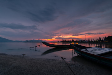 Sunset on Lap An lagoon and Lang Co Bay with colorful layers of cloud and . Lang Co Bay is one of the famous and beautiful bays of the world. HUE - VIET NAM