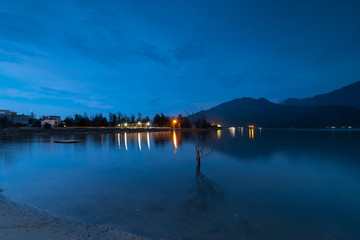 Sunset on Lap An lagoon and Lang Co Bay with colorful layers of cloud and . Lang Co Bay is one of the famous and beautiful bays of the world. HUE - VIET NAM