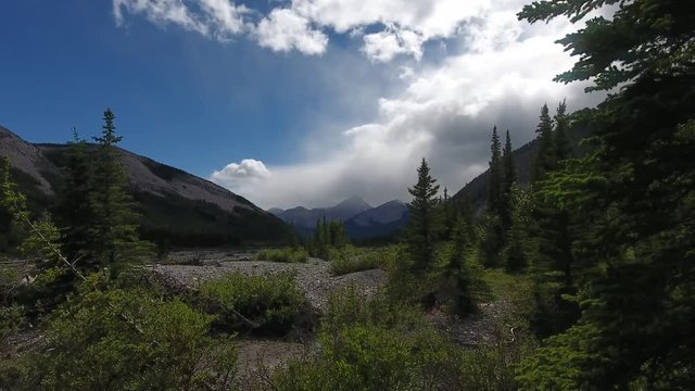 Clouds drifting in over the majestic rocky mountains near Calgary Alberta Canada