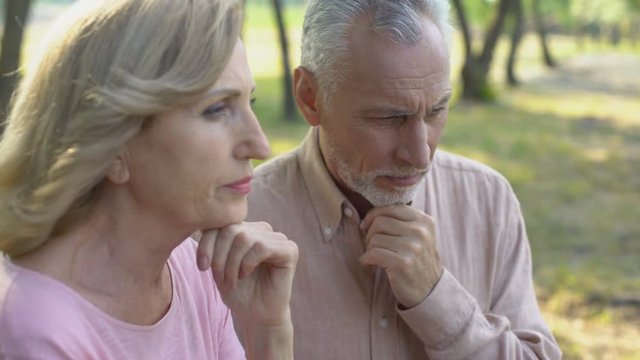 Old couple thinking over age-related health problems, low social protection