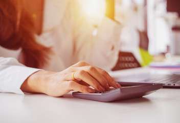 Fototapeta premium Business woman calculating budget numbers, Invoices and financial adviser working.
