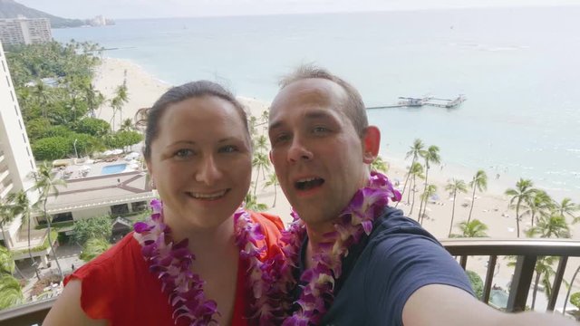  Professional video of happy couple taking a selfie at Waikiki beach in Honolulu Hawaii in 4k slow motion 60fps